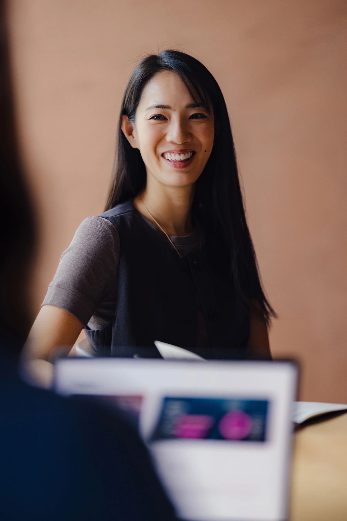 Asian business consultant in a professional office setting
